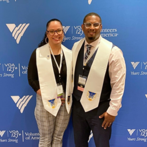 Tiffany and Junior pose for the camera with their VOA Ministry stoles.