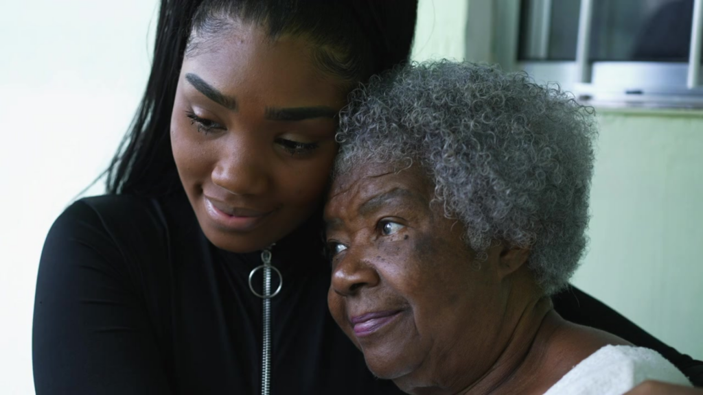 A young woman gently hugs a older woman caringly.
Caring Gift of Hope