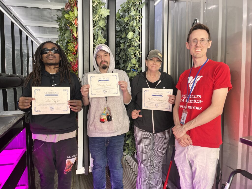 Three clients completing their workforce development course with VOA Lead Farmer.