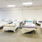 Row of beds in Code Blue shelter